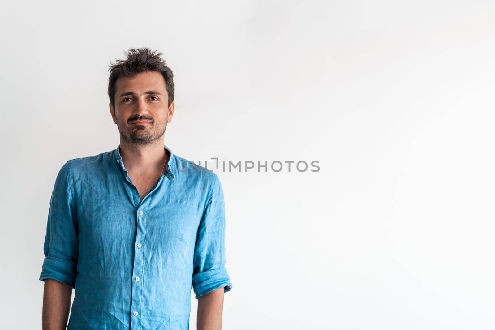 Formal business male portrait. A confident successful casual businessman or manager stands in front of a white background. by dotshock