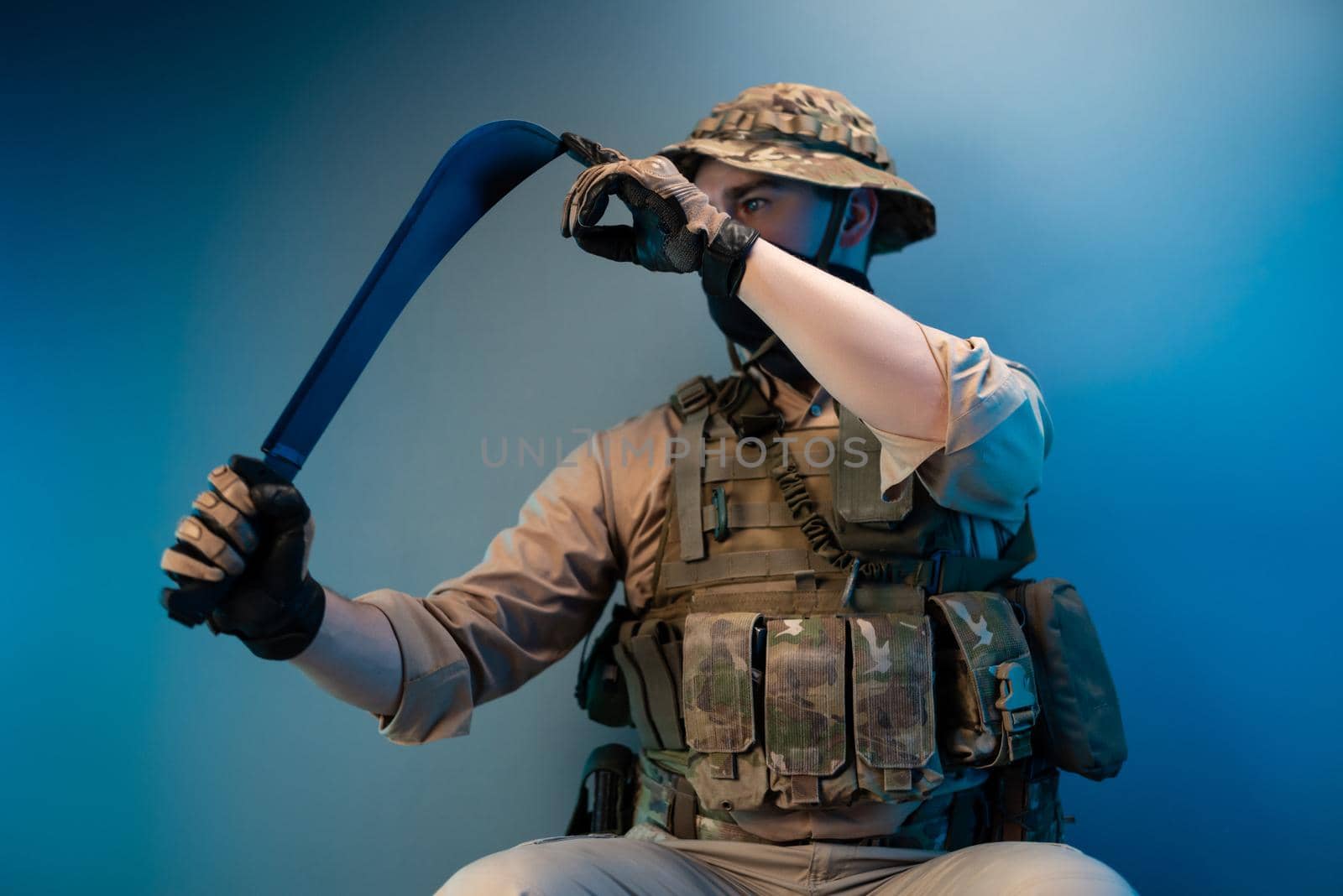 an army soldier in military clothes with a machete in his hand by Rotozey