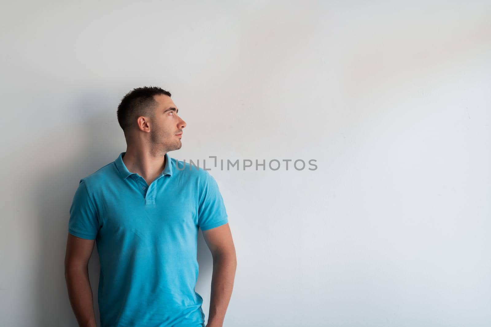 Formal business male portrait. A confident successful casual businessman or manager stands in front of a white background. High-quality photo