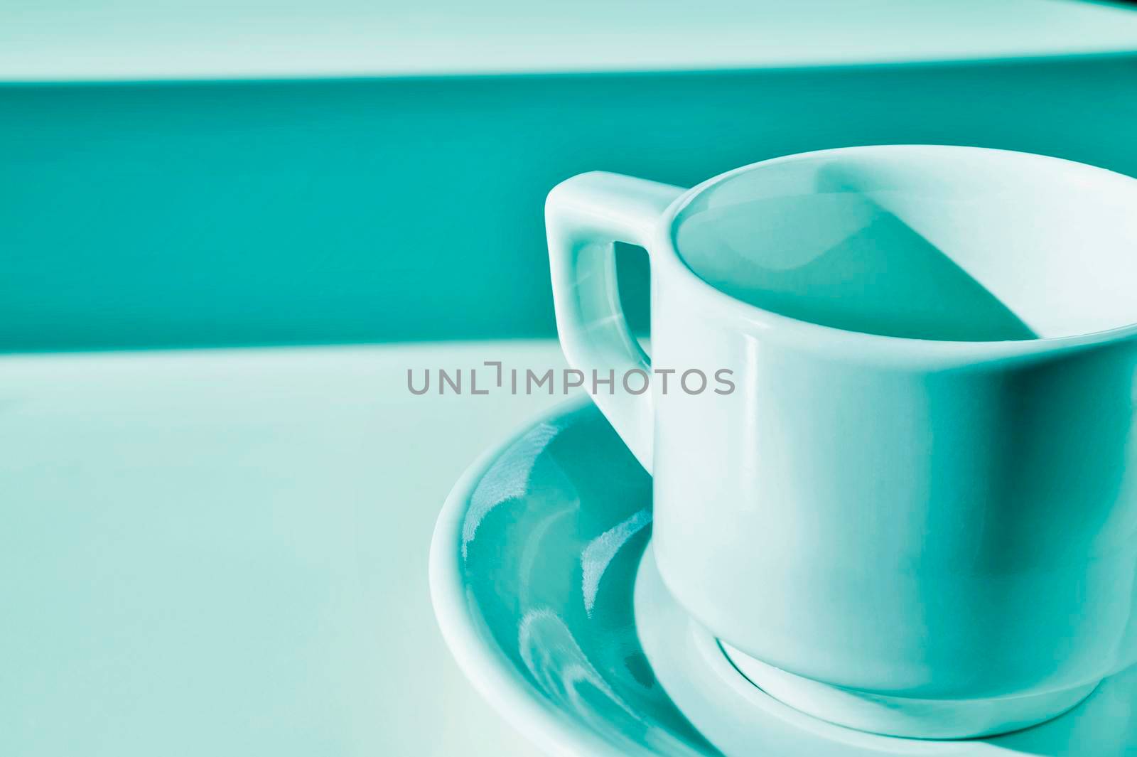White cup of coffee on blue background  , break time
