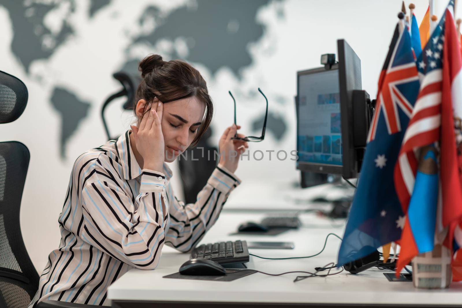 Beautiful Shocked and Annoyed Young Woman Looking her Laptop. Sad Operator Agent Woman Working from Home in a Call Center by dotshock