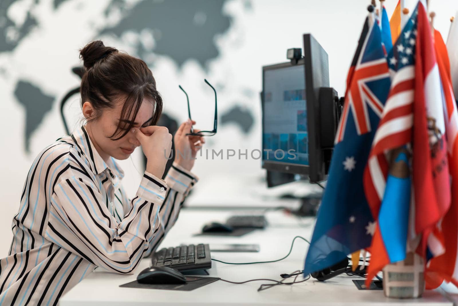 Beautiful Shocked and Annoyed Young Woman Looking at her Laptop. Sad Operator Agent Woman Working from Home in a Call Center. High-quality photo