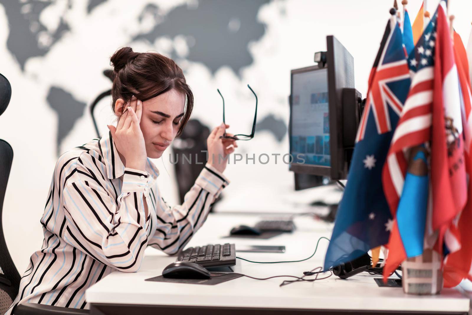 Beautiful Shocked and Annoyed Young Woman Looking at her Laptop. Sad Operator Agent Woman Working from Home in a Call Center. High-quality photo