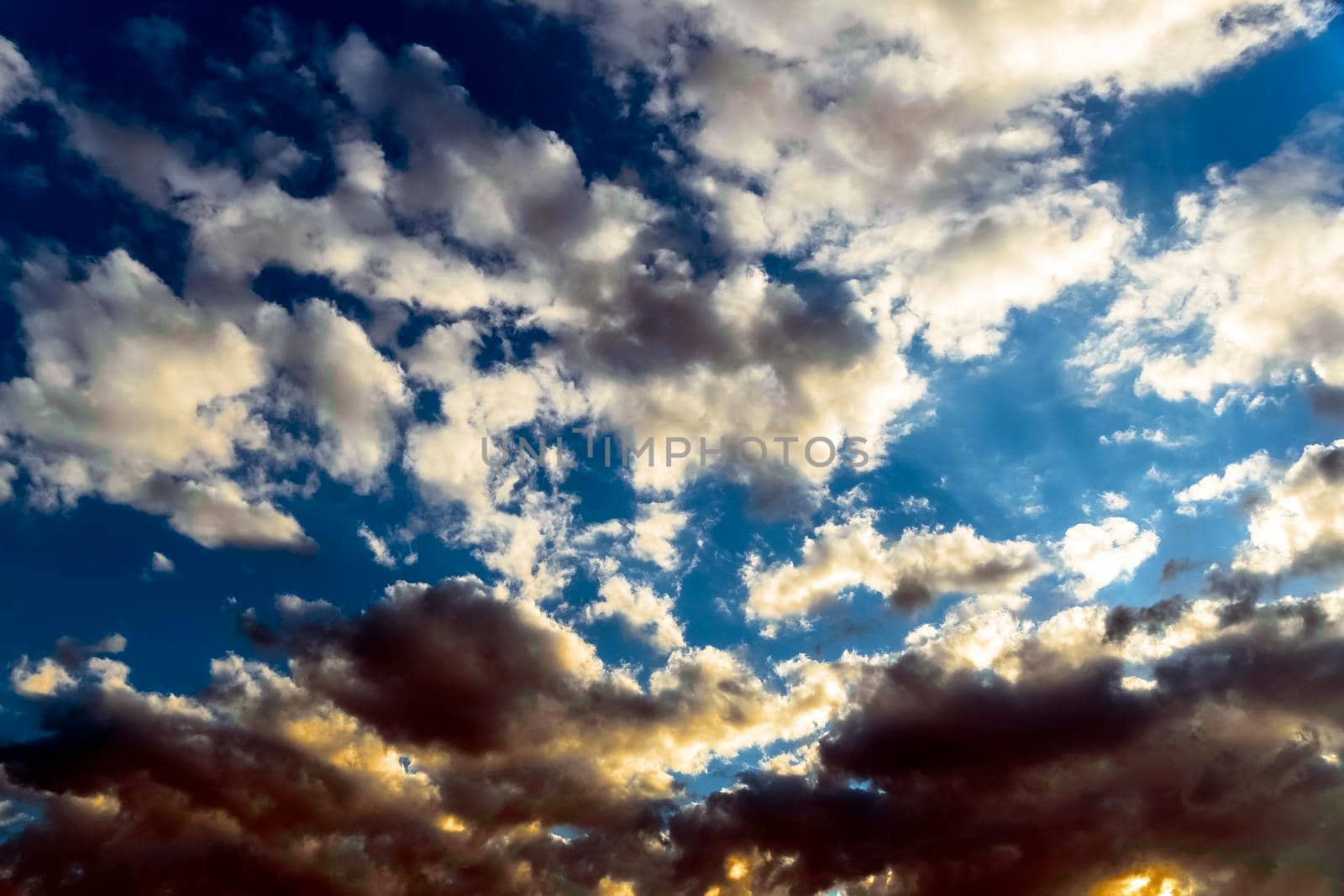 Panoramic view of the blue sky with clouds in motion. View of the blue sky with clouds in motion.Nice weather with clear skies.Heavenly Light.Dramatic sky with clouds by YevgeniySam