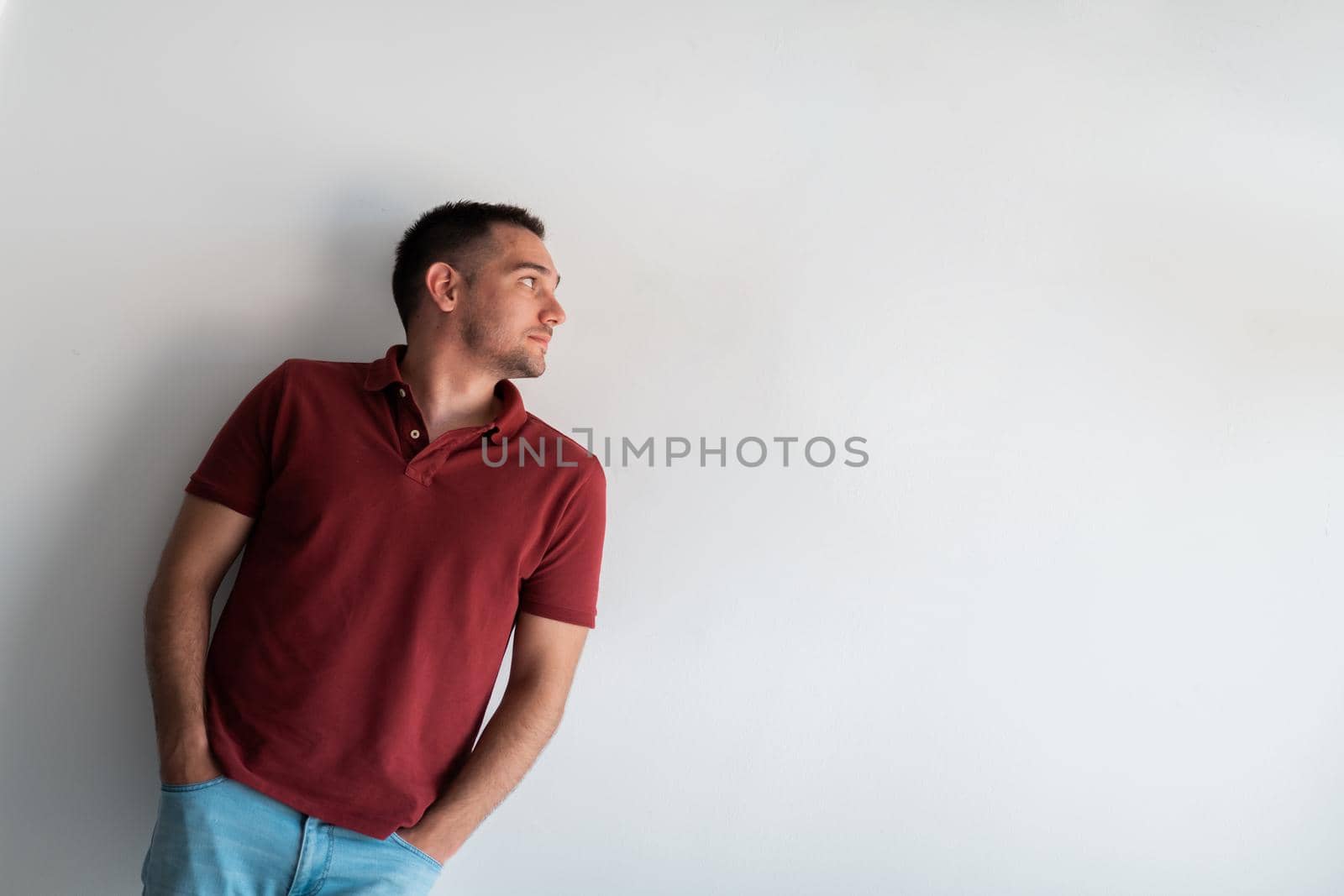 Formal business male portrait. A confident successful casual businessman or manager stands in front of a white background. High-quality photo