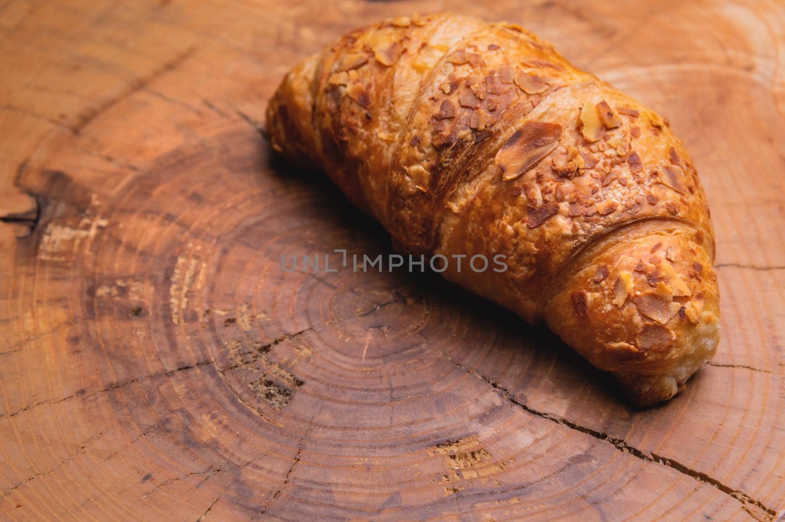 Freshly baked croissant on a wooden Tray. Delicious and healthy breakfast.
