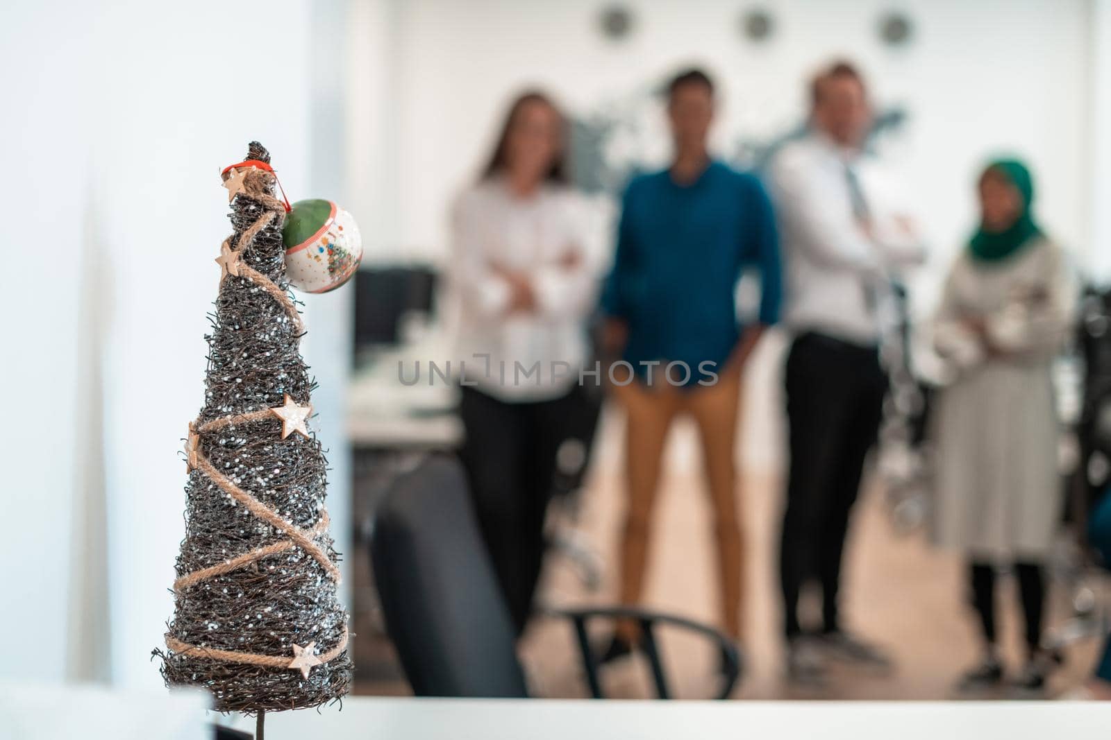 Portrait of young excited multiethnics business team of software developers standing and looking at camera at modern startup office by dotshock