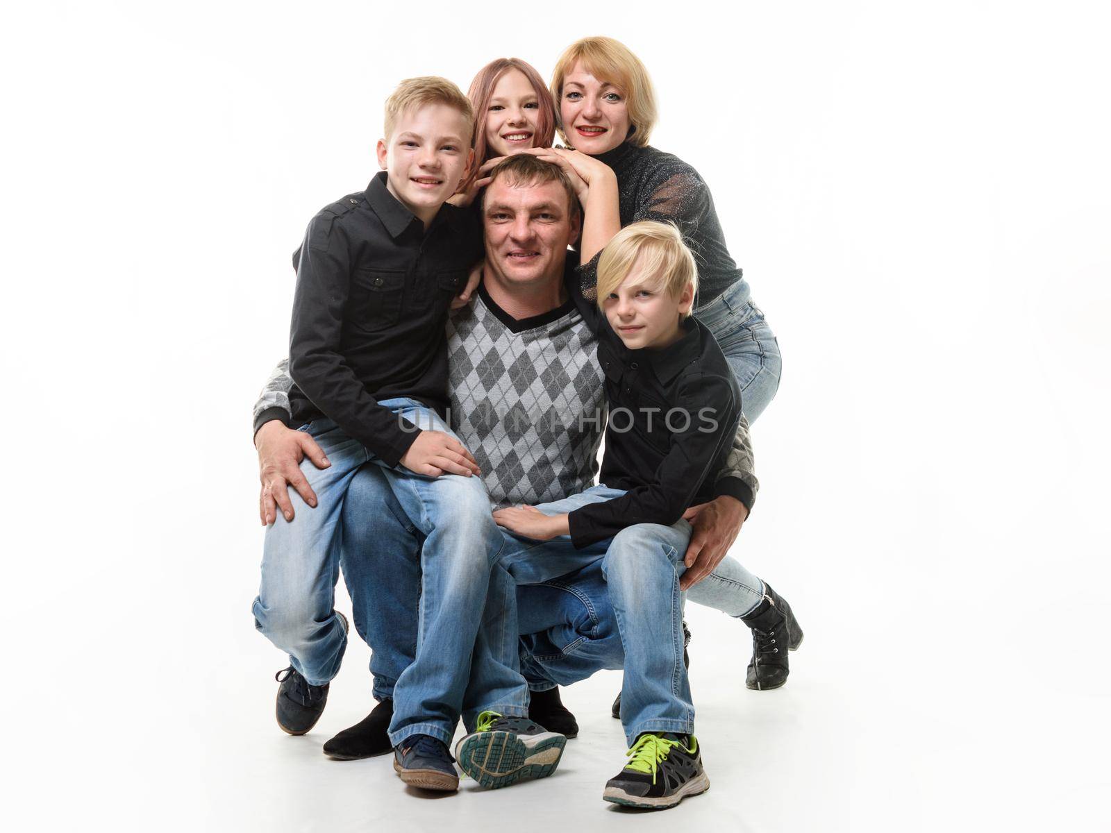Children and mom hug happy dad, isolated on white backgrounda