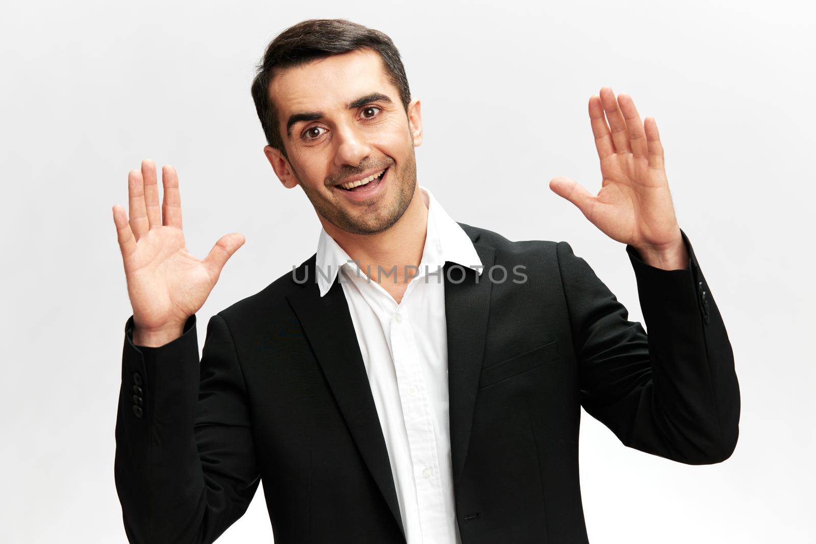 man black suit hand gestures emotions business and office concept. High quality photo