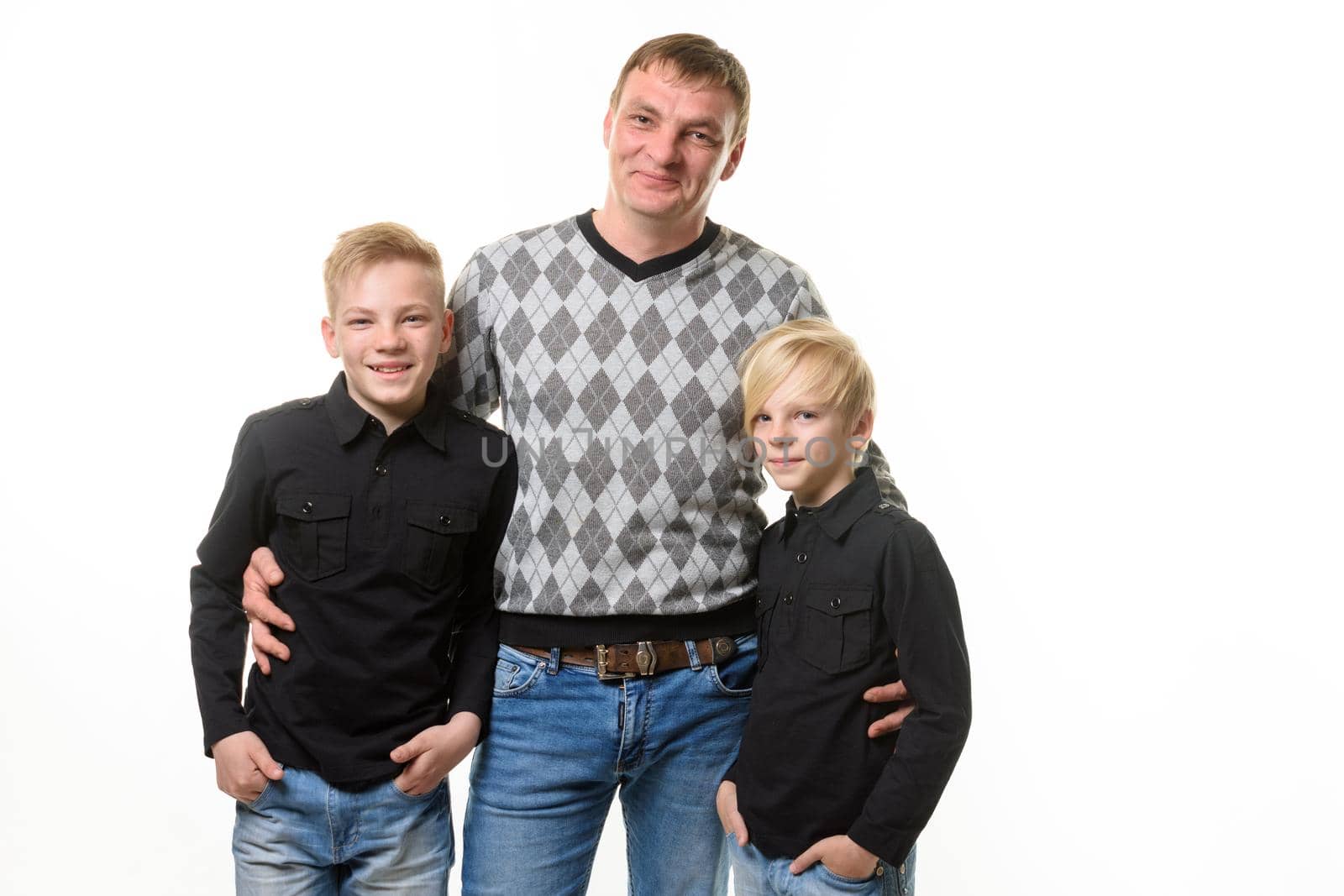 Half-length portrait of a father and two sons in casual clothes, isolated on a white background by Madhourse