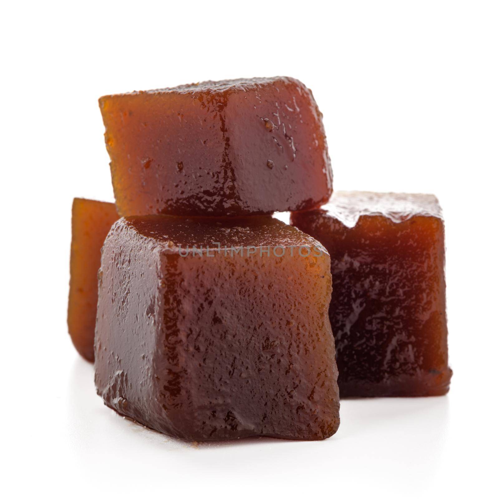 Marmalade cubes isolated on white background.