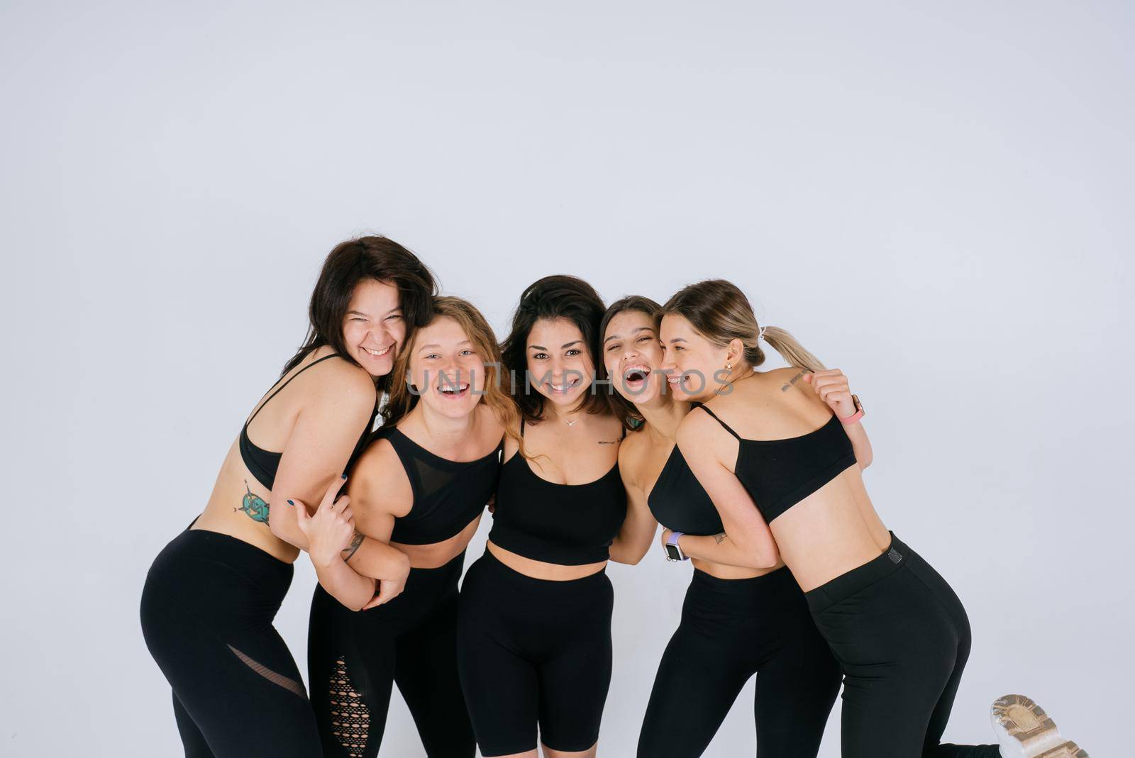 diverse models laughing, enjoying time together, look at camera by teksomolika