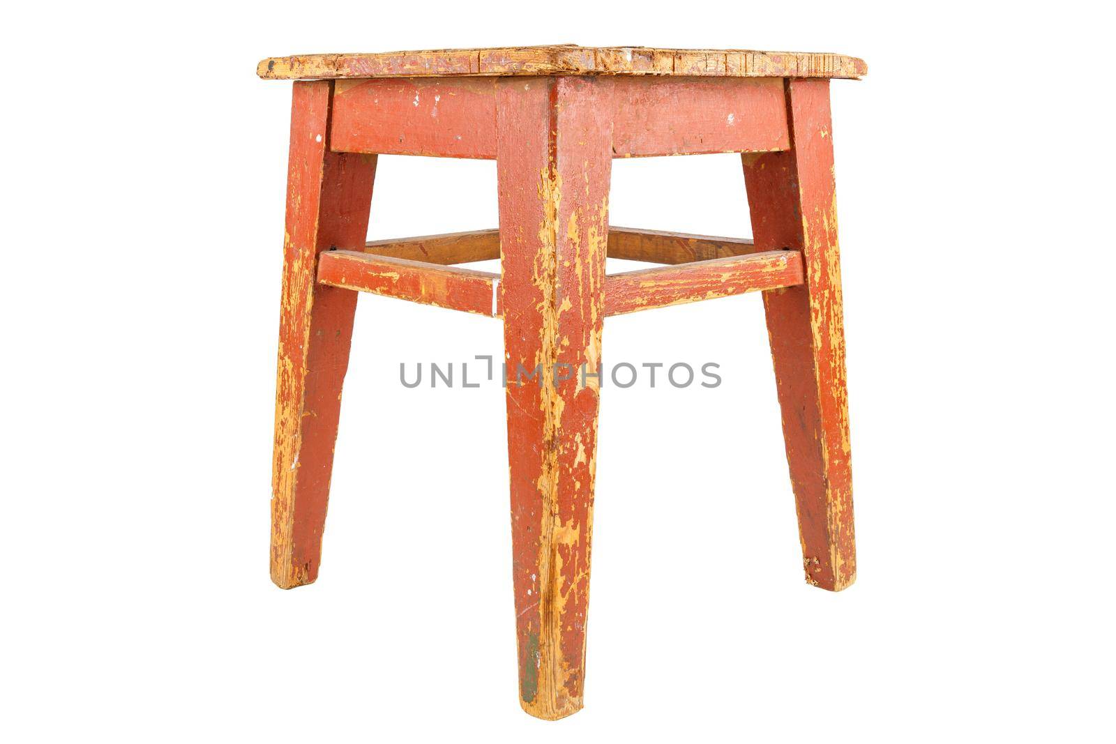 old used wooden stool with brown peeling paint. Loft style chair isolated on a white background.