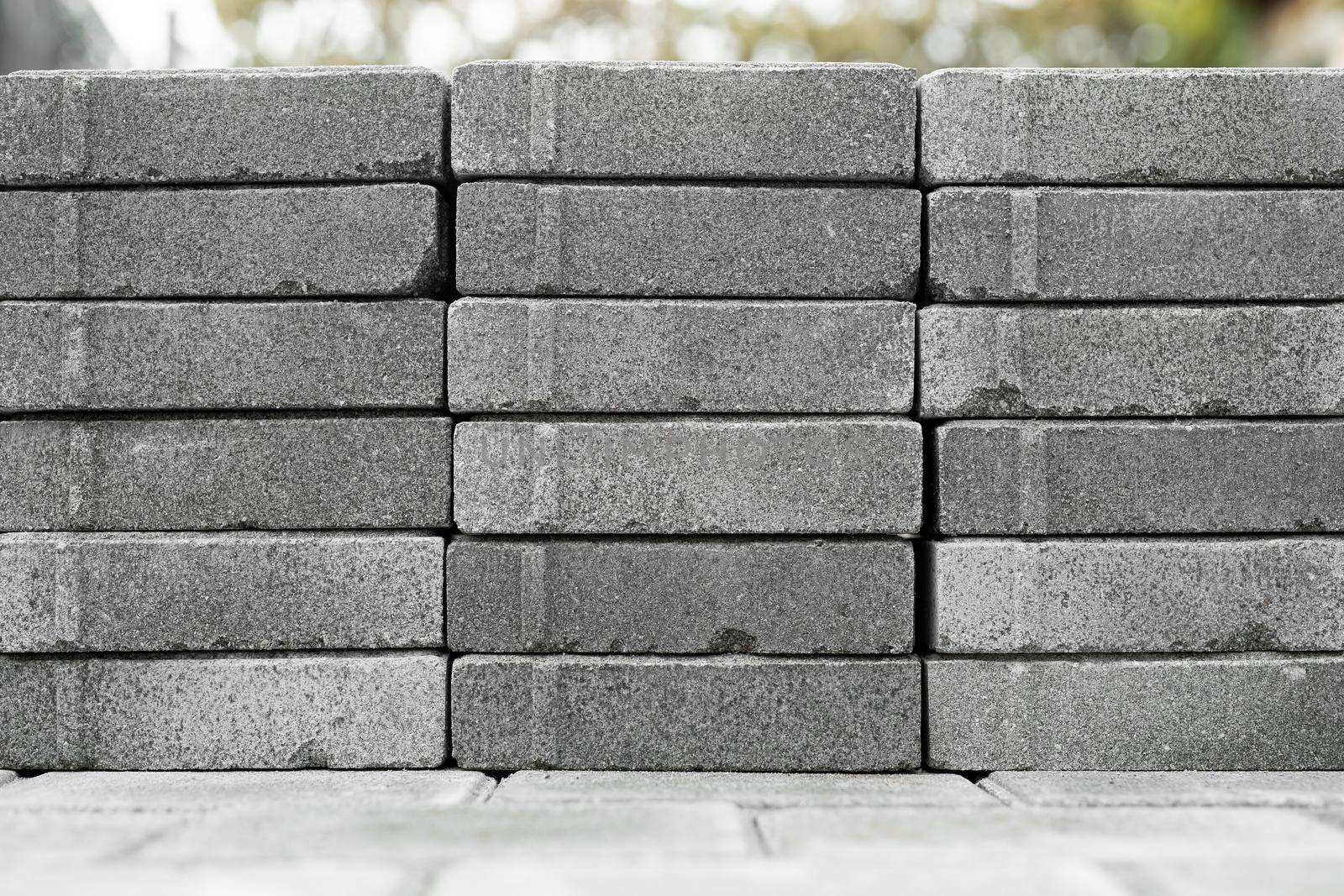 Grey paving bricks on the street for pavement road.