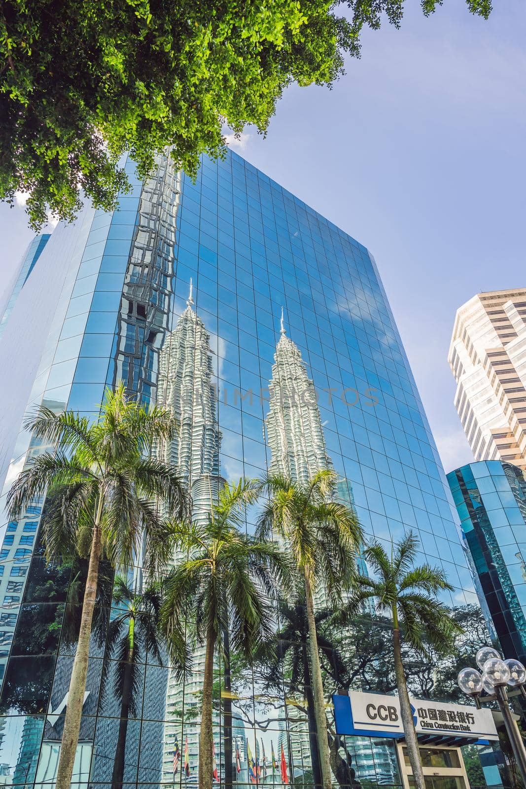 Kuala Lumpur, Malaysia - 03.26.2019: Petronas Twin Towers, the symbol skyscraper of Kuala Lumpur. reflected in the building.
