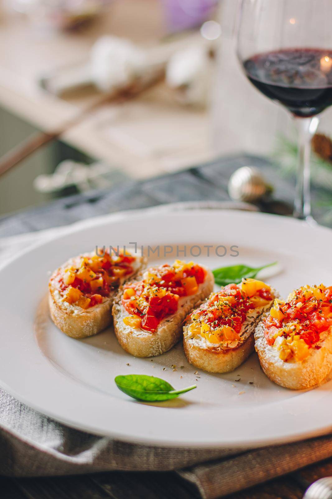 Catering table set service at restaurant before party. Canapes bruschetta with seeds, mozarella and tomatos