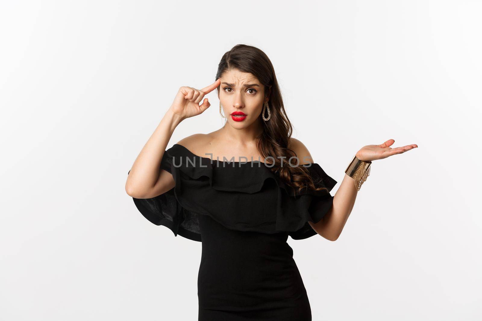 Fashion and beauty. Annoyed and bothered woman pointing at head, scolding someone for stupid mistake, looking confused, standing over white background by Benzoix