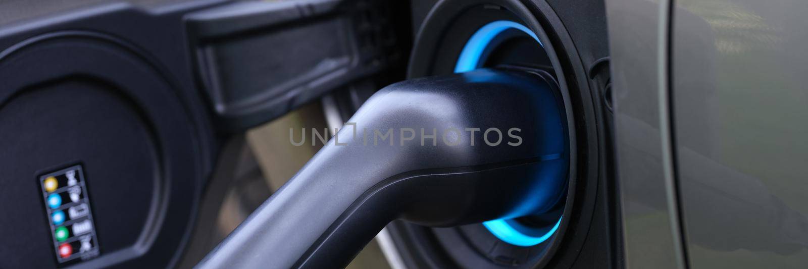 Electromobile charging plug is inserted into vehicle charging socket by kuprevich