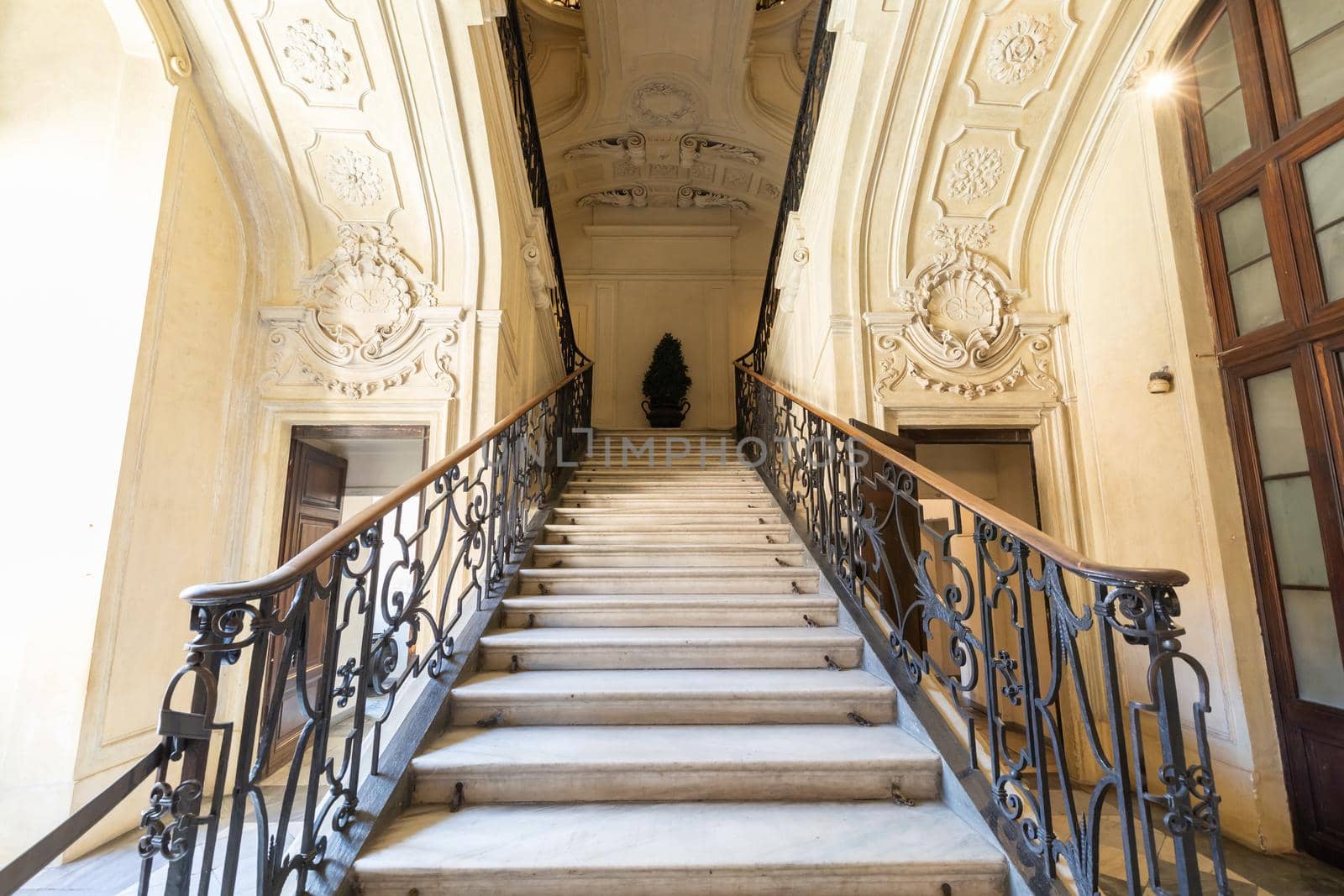 Turin, Italy - Circa August 2021: marble staircase in historic palace with luxury interior - Savoia Royal Palace