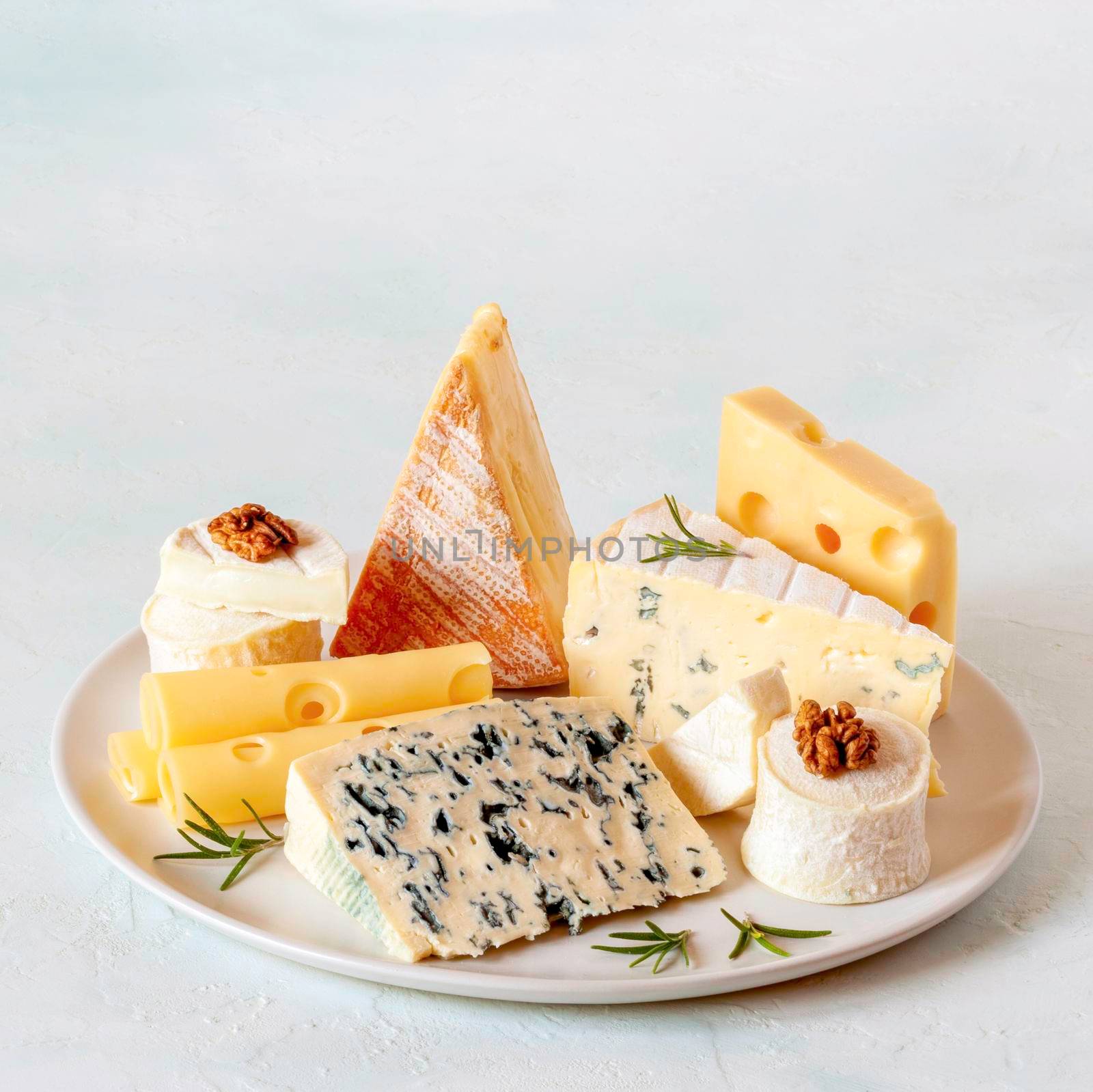 cheese plate with different types of french cheese, square frame