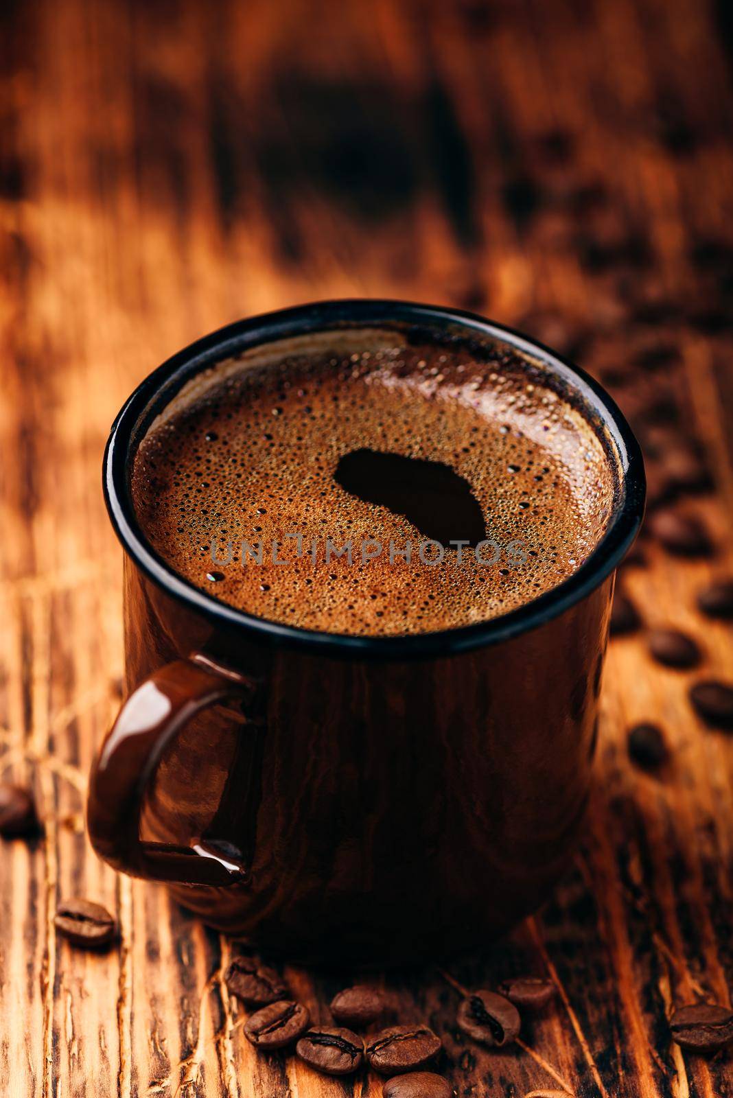 Brewed black coffee in metal mug by Seva_blsv