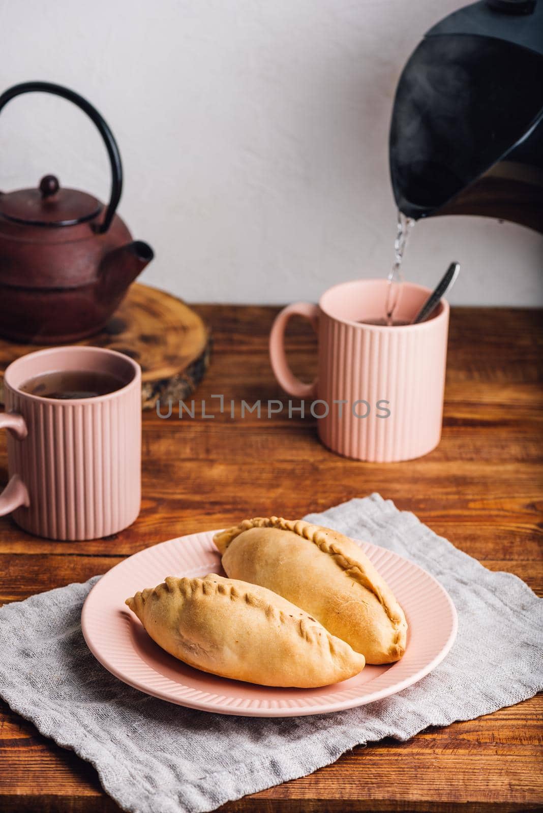 Two Cabbage Hand Pies on Plate by Seva_blsv