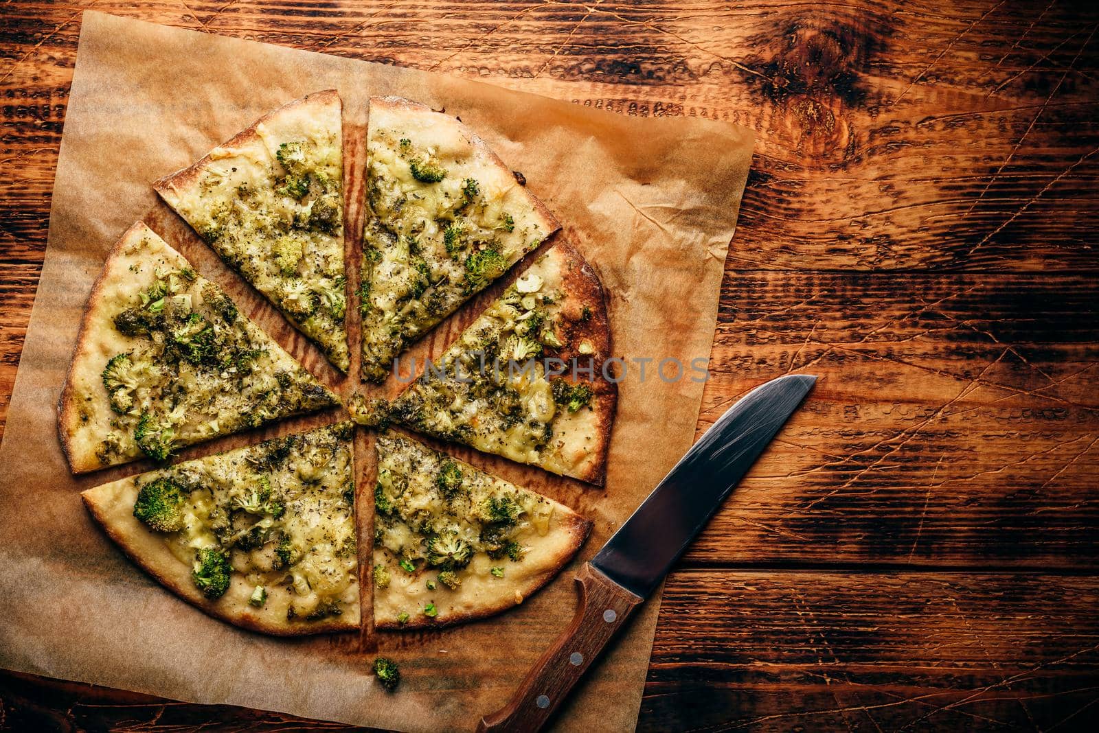 Italian pizza with broccoli, pesto and cheese by Seva_blsv