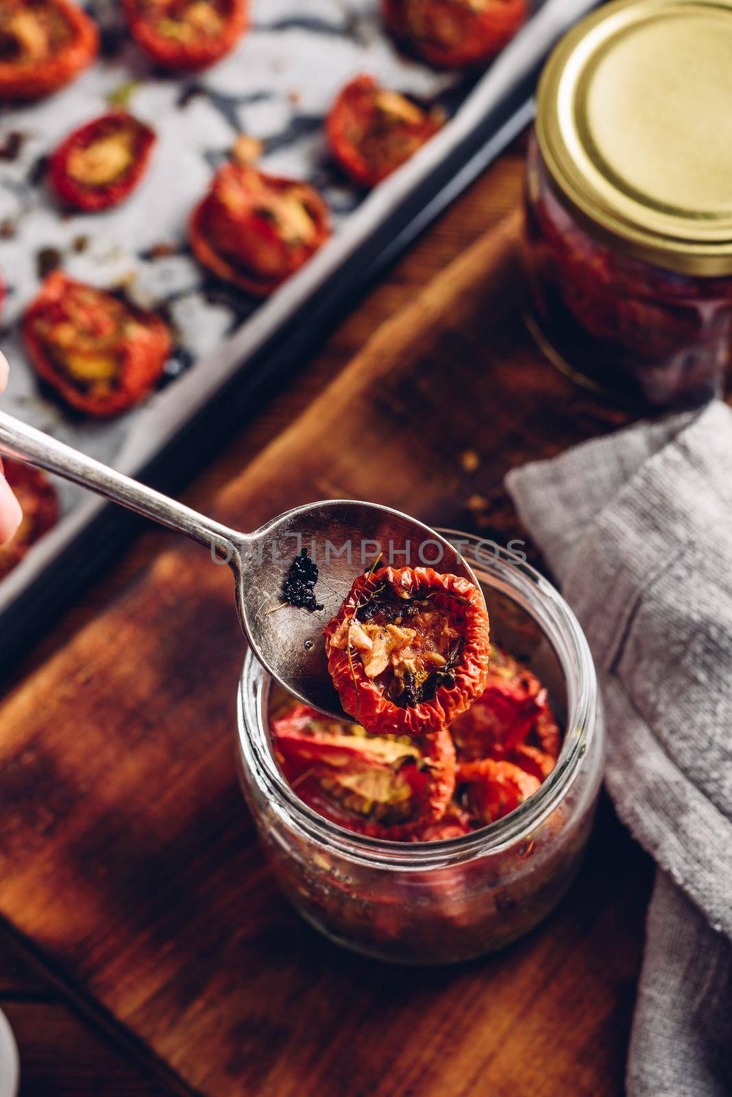 Preserving of Sun Dried Tomatoes with Thyme and Garlic in a Glass Jar