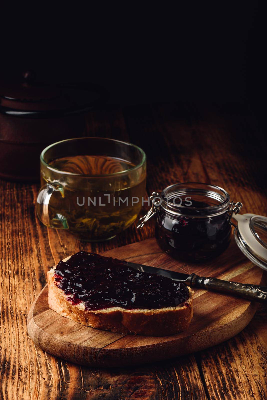 Toast with berry jam and green tea by Seva_blsv