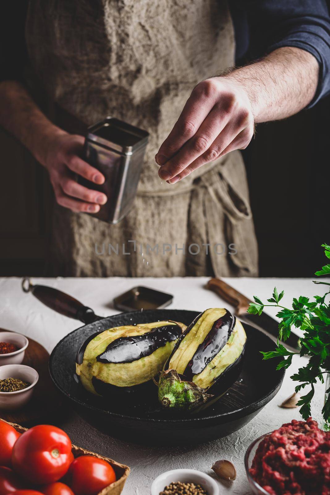 Preparing eggplants for baking and stuffing by Seva_blsv