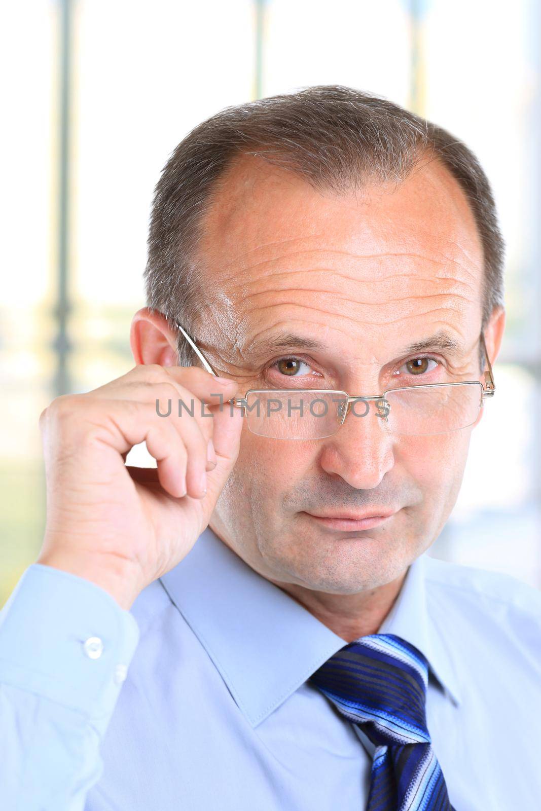 Portrait of a serious business man with glasses