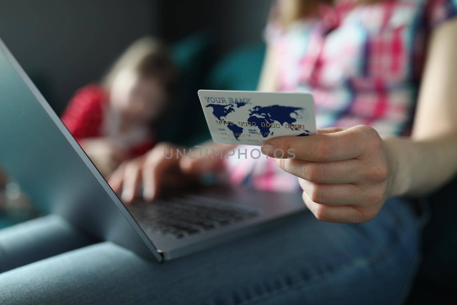 Woman typing on keyboard, holding credit card, pay online remotely, shopping on laptop from home by kuprevich