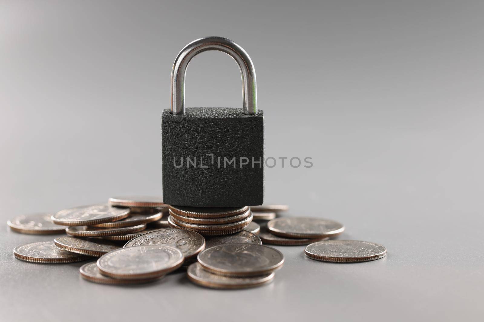 Close-up of padlock stand on stack of coin, financial security, symbol for protection finance. Keep savings in secure place. Security, safety, bank concept