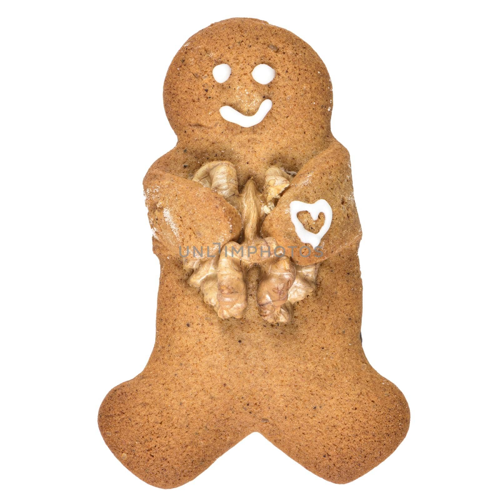 Gingerbread man cookie embrancing walnut isolated on white background.