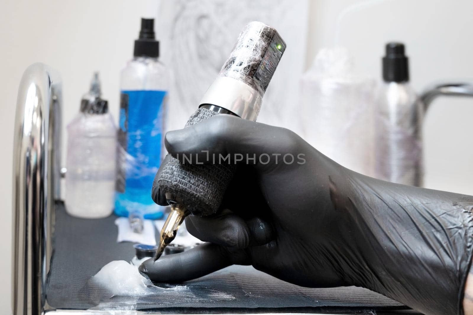 Close up of tattoo artist tools and workplace by HERRAEZ