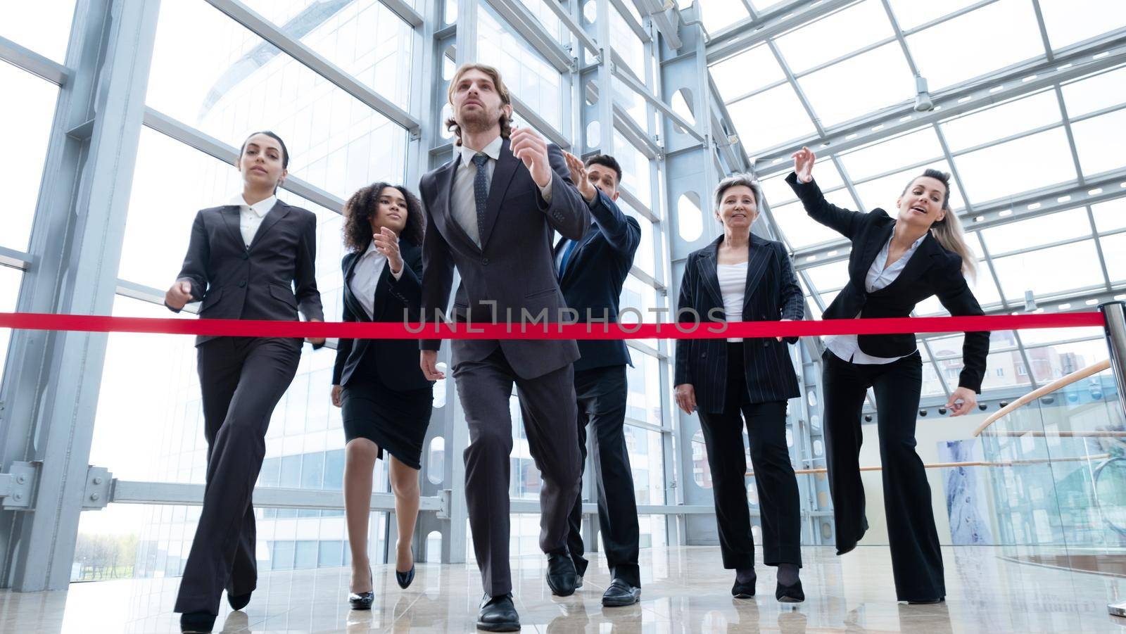 Businesspeople crossing the finish line rat race business people competition concept