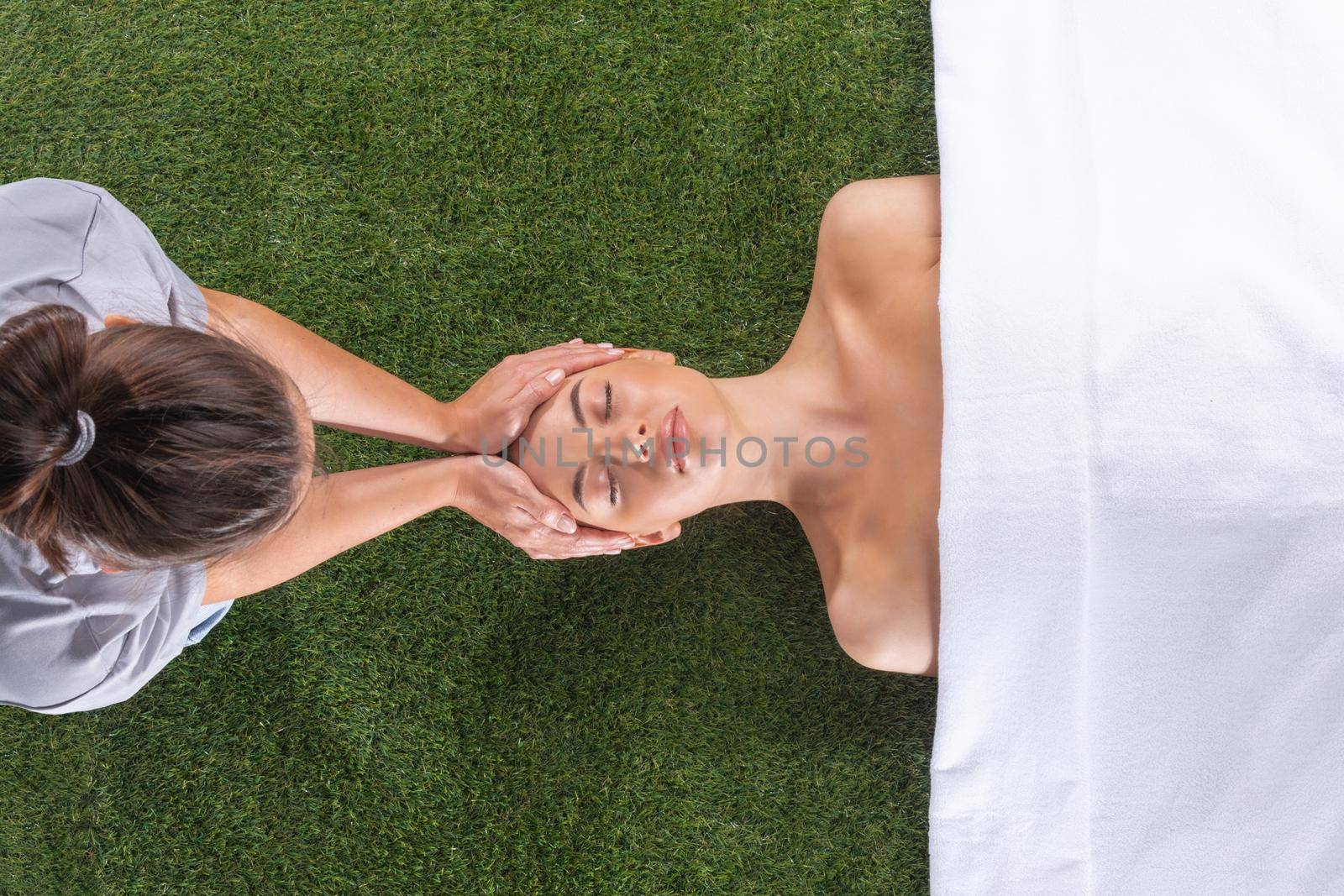 Woman at spa face massage by ALotOfPeople