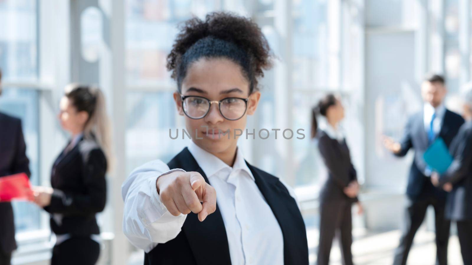 Young business woman pointing at you by ALotOfPeople