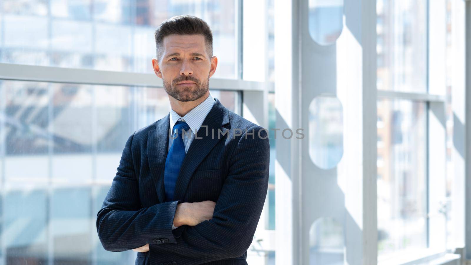 Businessman with arms folded by ALotOfPeople