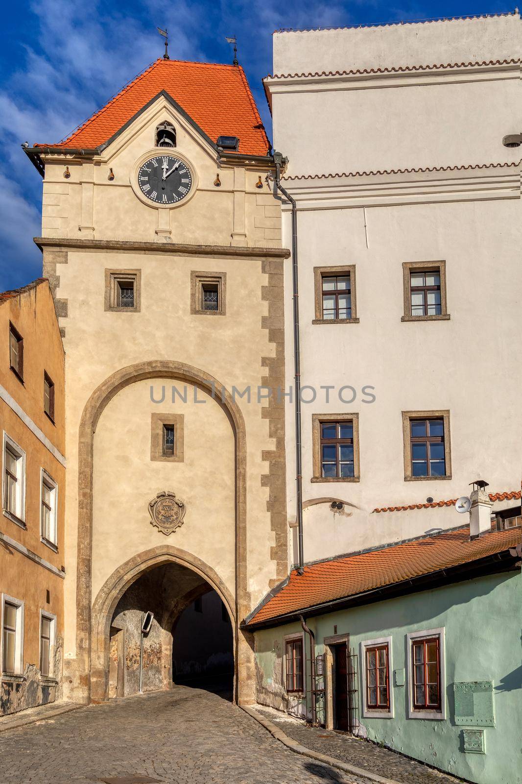 Old town view of narrow aisle with city gate in Jindrichuv Hradec, a town in the Czech Republic in the region South Bohemia. The old town view.