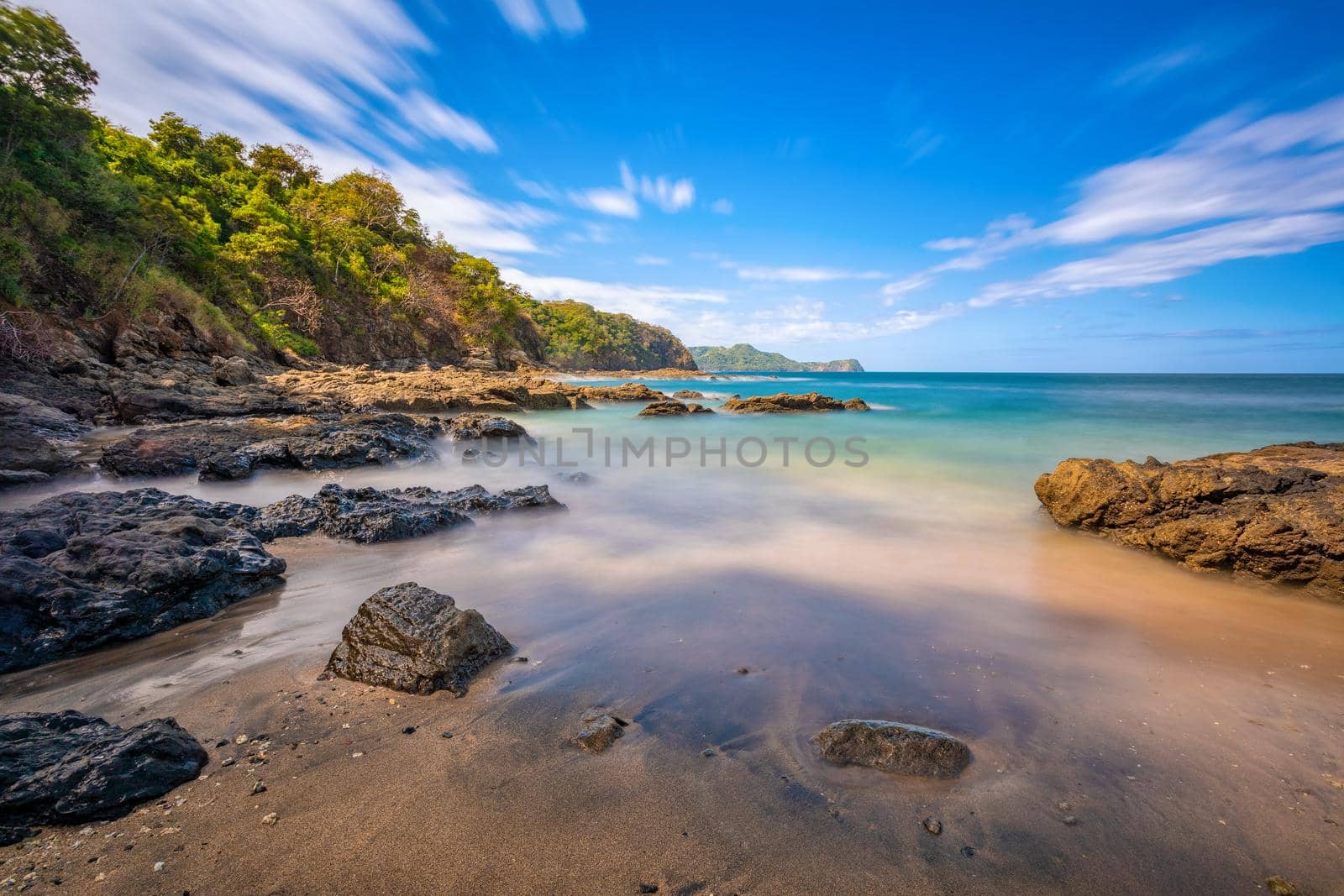 Long exposure, pacific ocean waves on rock in Playa Ocotal, El Coco Costa Rica by artush