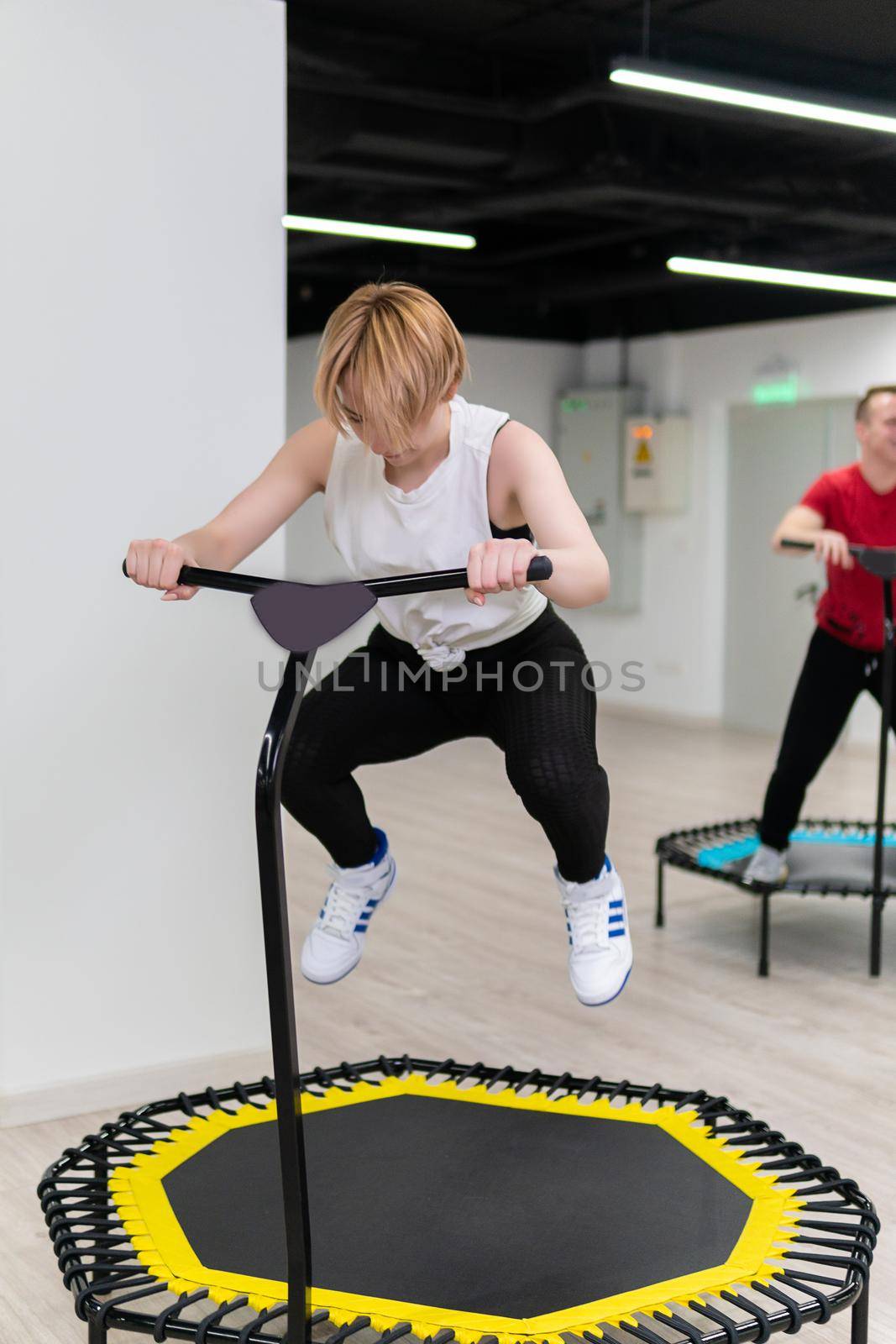 Women's and men's group on a sports trampoline, fitness training, healthy life - a concept trampoline group batut girl healthy, for female athletic from fitness from young shaping, shape beautiful. Studio beauty indoor, class by 89167702191
