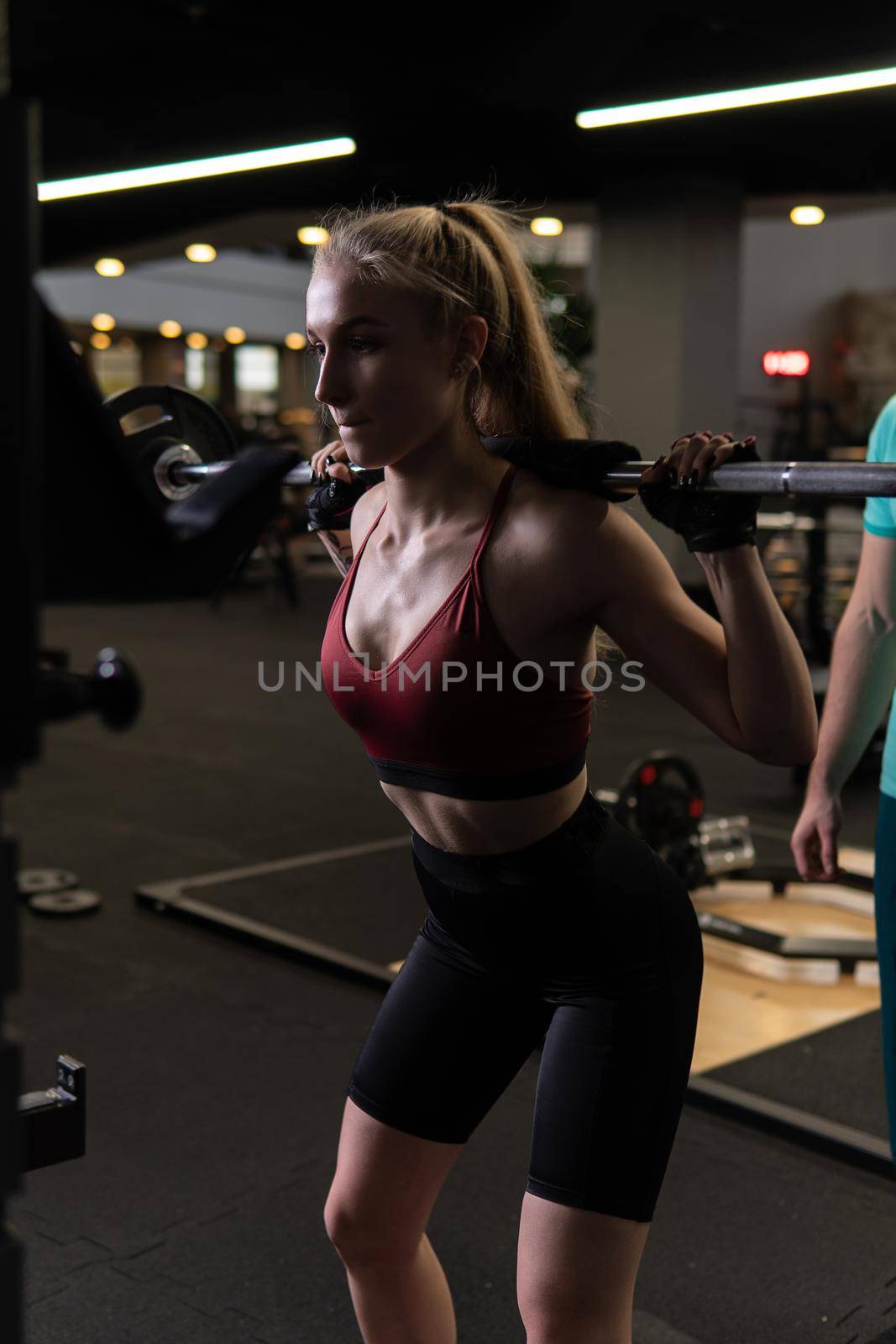 fitness woman black background a beautiful client to perform exercises in a fitness club, the concept of playing sports with a professional gym leisure lifestyle men occupation, from professional senior for weight and job older, sport woman. Client adult exercise, art