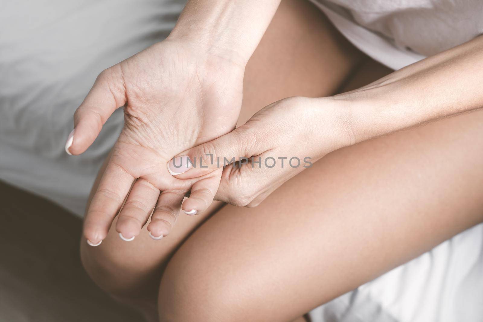 Hand numbness or limb numbness. Woman with hand pain and finger pain after sleep. High quality photo