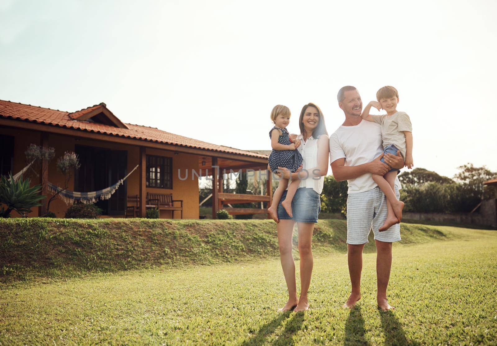 We are blessed to be together. Shot of a happy family bonding together outdoors. by YuriArcurs