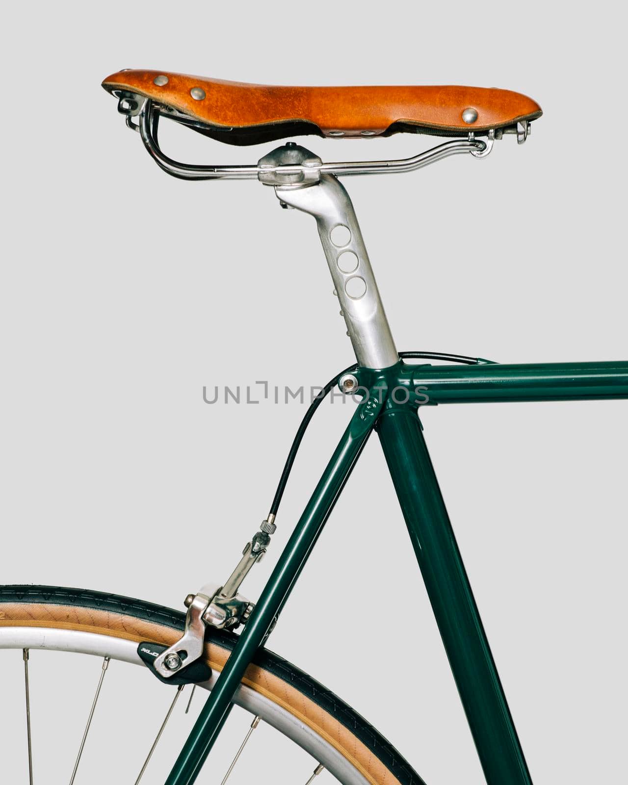 Vintage classic bicycle, with leather tape and saddle. White background. High quality photo