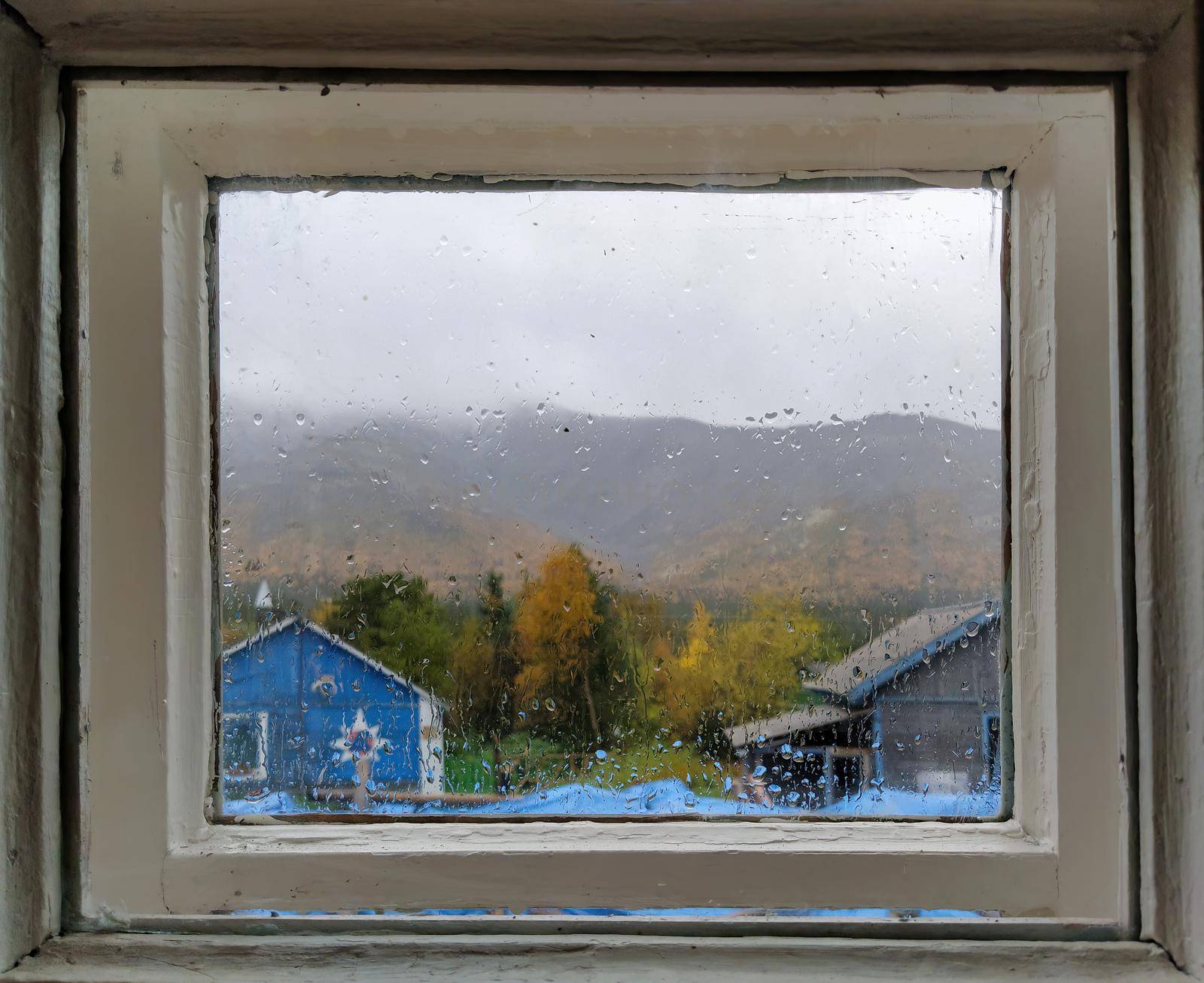 Rainy autumn day seen from a cottage window. photo