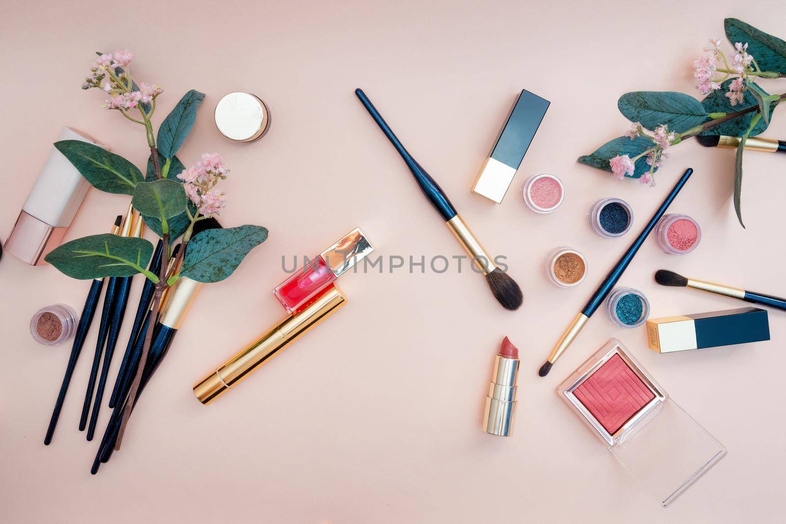 set of beauty cosmetics for female face and eye makeup on pink background. by Andre1ns