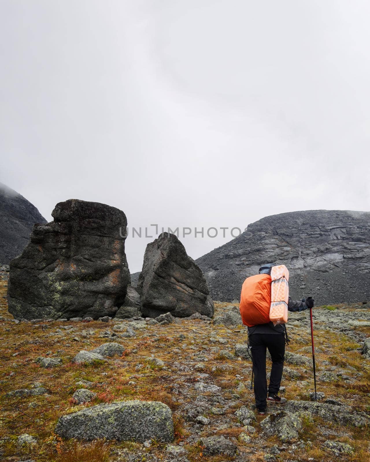 Hiker woman walking in a mountain rocky path by Andre1ns