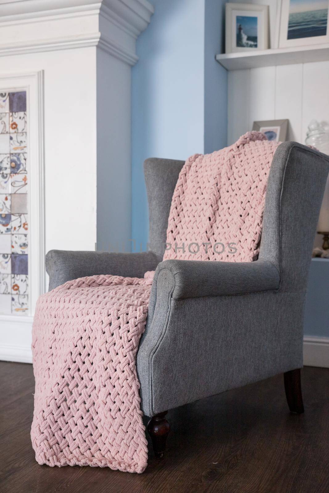 classic chair with brown pillow on carpet in vintage style bedroom interior